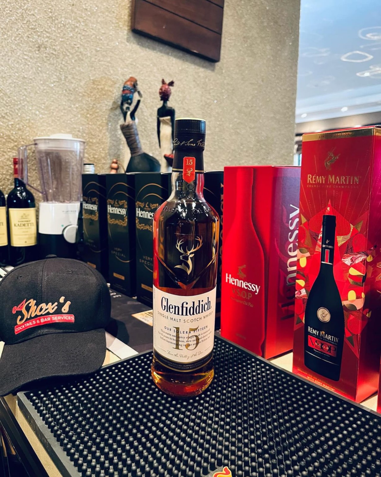Shox's bar setup with premium bottles